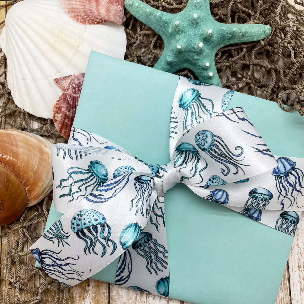 Jellyfish ribbon in shades of blue printed on 1.5" white satin